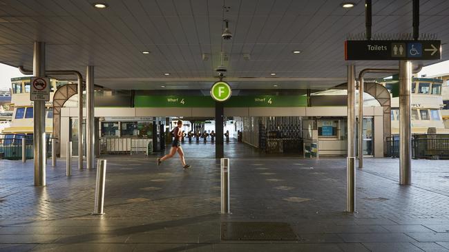 Lone runner at Circular Quay. Picture: Nick Cubbin