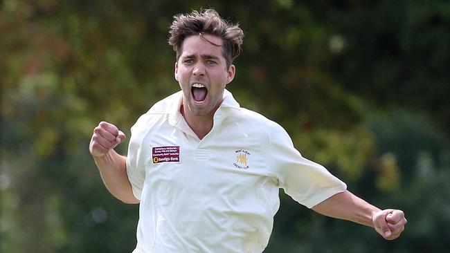 Mont Albert’s Andrew Padbury celebrates the wicket of Balwyn’s Elliott Forbes on Saturday.   Picture: Hamish Blair