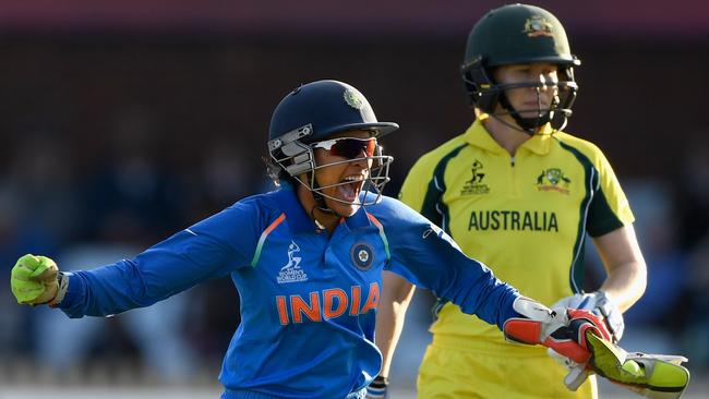 Australia batsman Alex Blackwell is bowled as Sushma Verma celebrates victory for India.