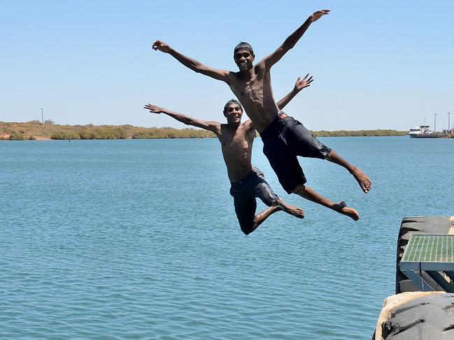 Tyron Miller (front) and Scott McKay (rear) cool off at Beadon Creek in Onslow, WA. File picture. Picture: Mike Edmonson