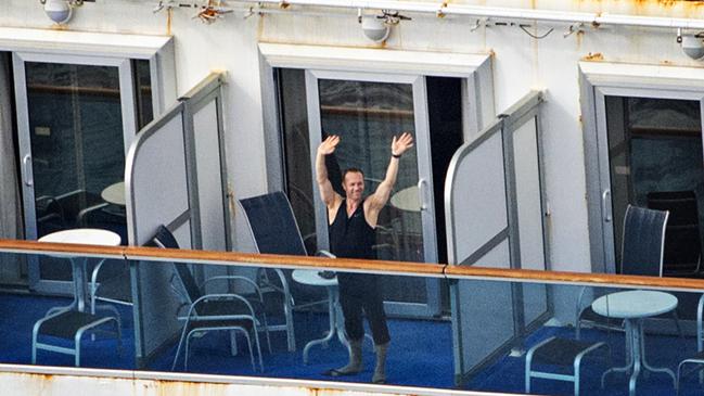 Passengers aboard the Ruby Princess cruise ship sitting off coast of Sydney on Wednesday.