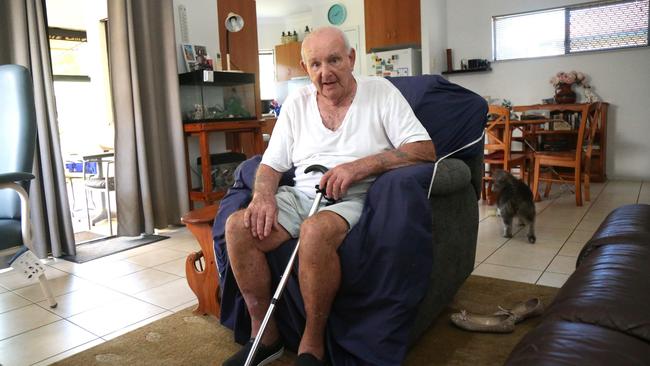 Kamerunga Villas resident Michael Brooks to keep cool in 35C heat has spent days since flooding cut power his unit in the bathtub filled with cold water. Picture: Peter Carruthers