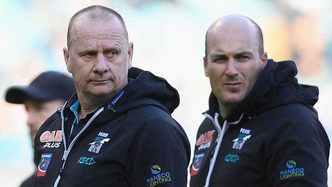 Power head coach Ken Hinkley with Port SANFL coach Matthew Lokan after the loss at the MCG. Picture: Quinn Rooney/Getty Images