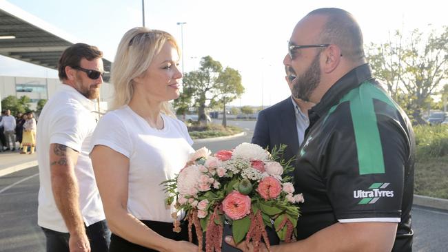 Pamela Anderson was touched by her flower welcome into Brisbane Airport by limo driver Jimmy Seoud. Pictures: Nathan Richter.