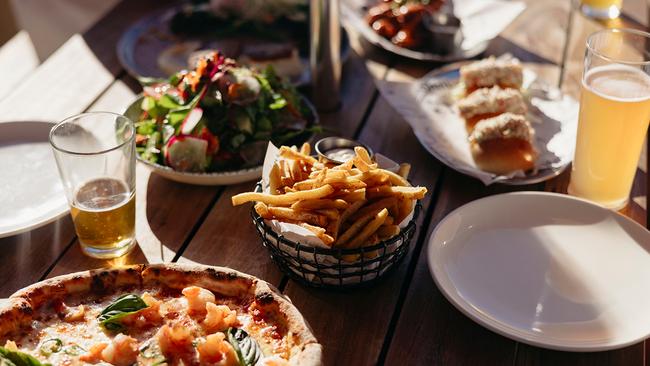 Order typical pub fare or pizzas from the imported Italian pizza oven at Shelter Brewing Co. Picture: Tourism Australia.