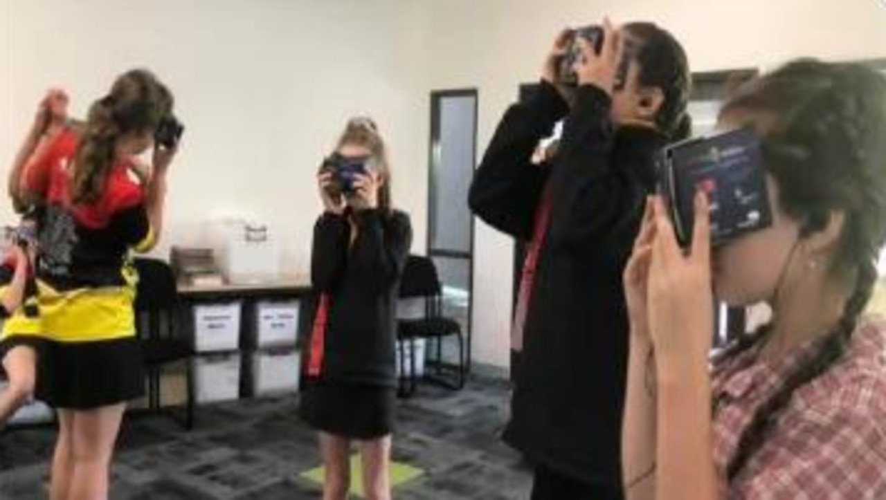 Students using virtual reality to learn about water safety.