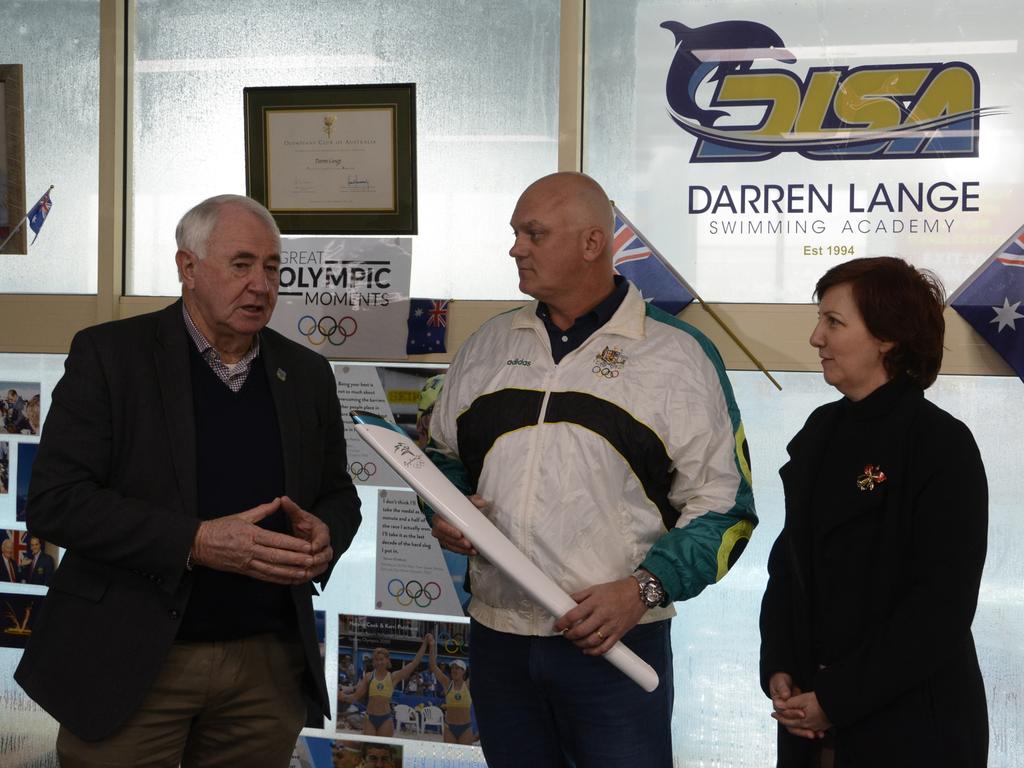 Toowoomba Regional Council Mayor Paul Antonio, former Olympian Darren Lange and Toowoomba and Surat Basin Enterprise CEO Ali Davenport celebrate the announcement of Brisbane as the host city for the 2032 Olympic Games.