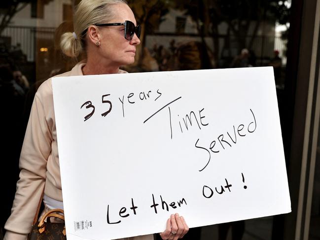 A supporter holds a sign at a press conference with Menendez family members outside the Criminal Courts Building in Los Angeles, California. Picture: Getty/AFP