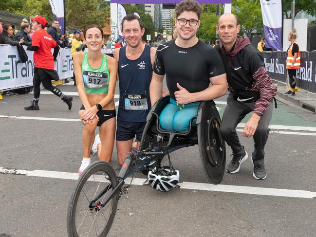 Winners Sinead Diver, Liam Adams, Sam Rizzo with Steve Moneghetti at the finish line. Picture: Tony Gough