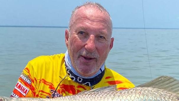 Lord Ian ‘Beefy’ Botham catching barramundi before falling off the boat.