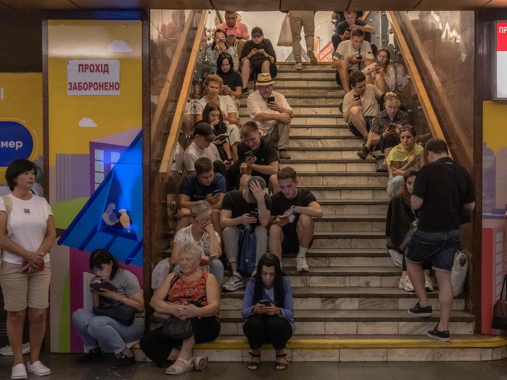 Kyiv civilians take shelter in the Teatralna metro station during a Russian air attack.