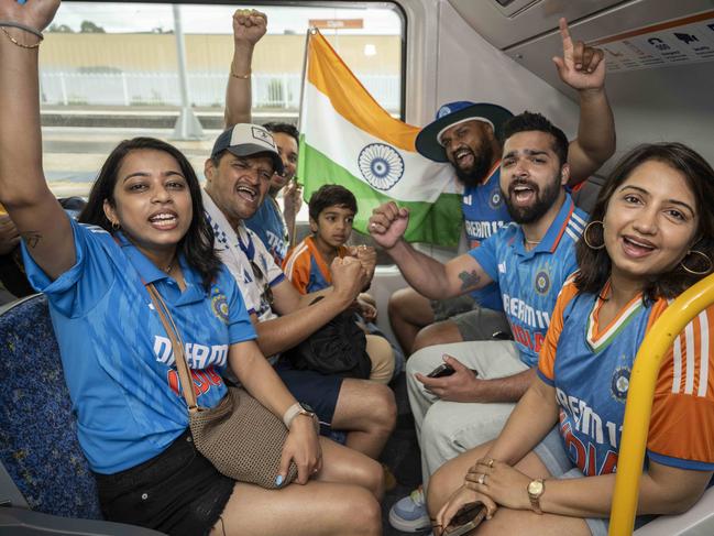 Families from Harris Park cricket club travelling together on the train to the SCG for the first day of the Pink Test. Picture: Monique Harmer