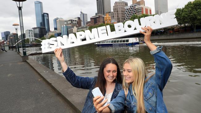 Ella de Graaf, 15, and Brianna Willey, 16, snap a selfie for SnapMelbourne. Picture: Alex Coppel