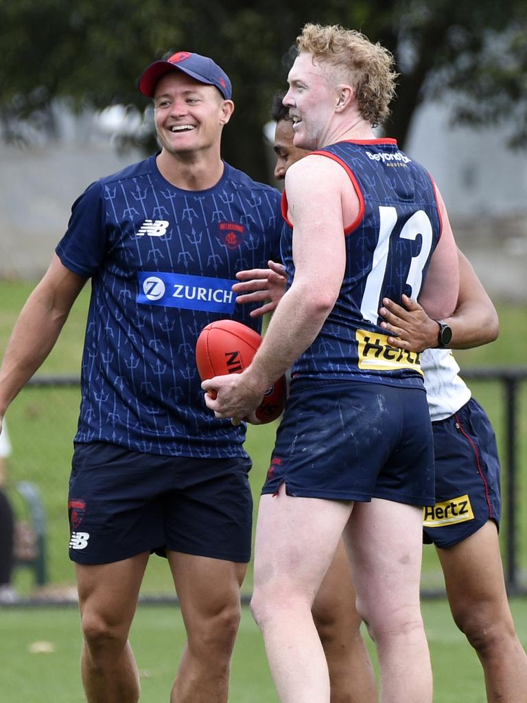 Clayton Oliver is embraced after returning to Demons training. Picture: Andrew Henshaw