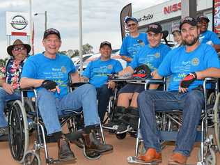 INCLUDE EVERYONE: Participants of the Wheelchair challenge parading down the main street of Gatton. Picture: Meg Bolton