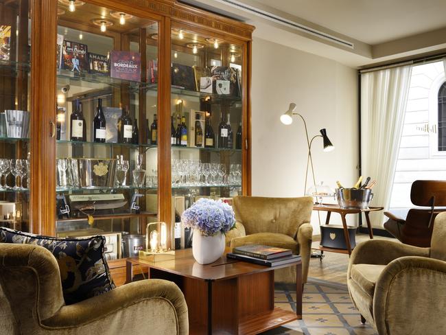 Armoires are filled with fine glassware and champagne buckets at Hotel de’Ricci.