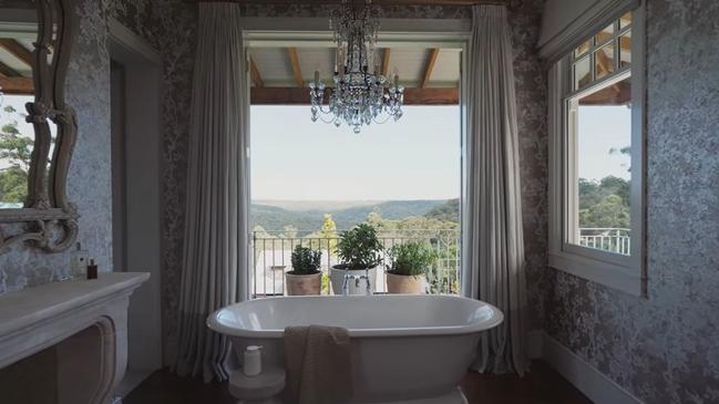 A bath with a view, and one of 11 fireplaces in the home. Picture: Cadence&amp;Co