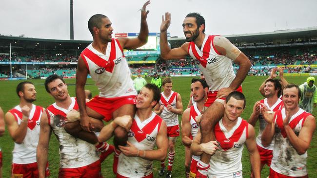 Michael O’Loughlin and Adam Goodes are chaired off the SCG after playing milestone games. Picture: Phil Hillyard