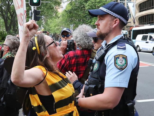 Protestors from Extinction Rebellion (XR) gather with beekeepers at  the Archibald Fountain at Hyde Park in Sydney to perform the death of bees at a die-in protest.Picture: Richard Dobson