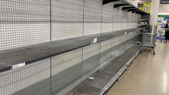 Shelves usually stocked with toilet rolls are now empty all over Australia. Picture: AAP