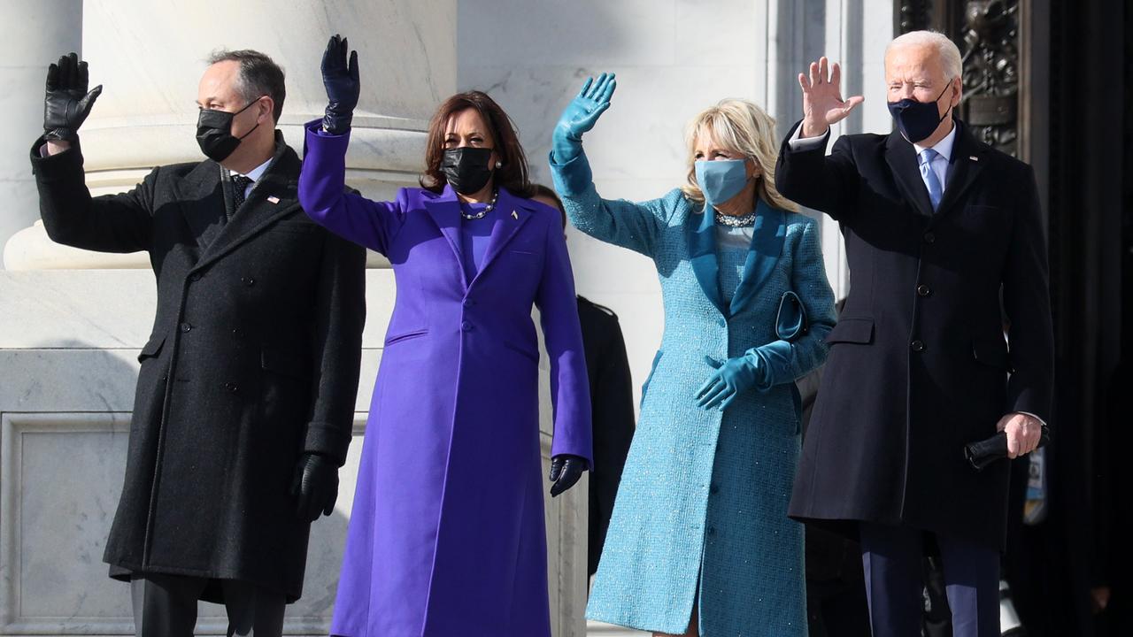 Doug Emhoff, Kamala Harris, Jill Biden and Joe Biden wave as they arrive on the East Front of the US Capitol for the inauguration. Picture: Joe Raedle/Getty Images