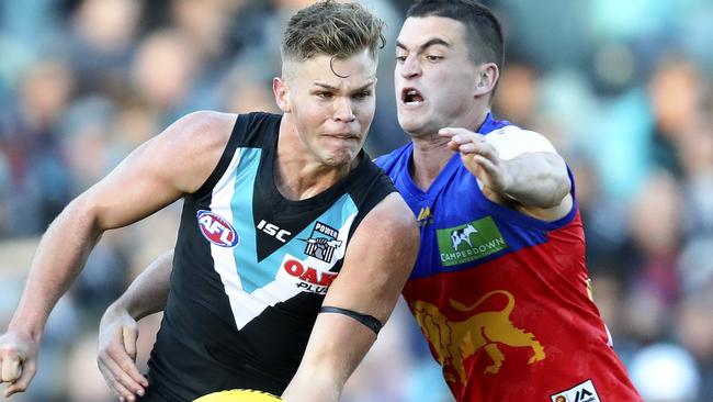 Tom Rockliff won’t have to worry about laying tackles on Port Adelaide players from Round 1 next season. Picture: Sarah Reed