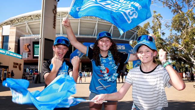 Lachlan Brumfield, 13, Isabel Brumfield, 14, and Emily Brumfield, 11, getting ready for the start of the Men's Big Bash League match between the Adelaide Strikers and the Sydney Thunder at Adelaide Oval. Picture: Kelly Barnes/Getty Images