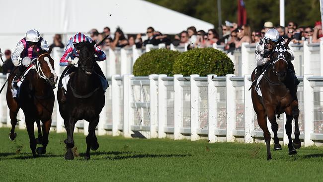 Miss Cover Girl stormed down the outside to win the last Group 1 race of the season.