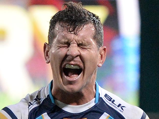 BRISBANE, AUSTRALIA - JULY 24: Greg Bird of the Titans shows his disappointment after Alex Glenn of the Broncos scores a try during the round 20 NRL match between the Brisbane Broncos and the Gold Coast Titans at Suncorp Stadium on July 24, 2015 in Brisbane, Australia. (Photo by Bradley Kanaris/Getty Images)