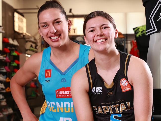 MELBOURNE, AUSTRALIA - OCTOBER 23: Marianna Tolo of the Bendigo Spirit and Jade Melbourne of the UC Capitals pose for a photo during the WNBL 24/25 Season Launch at Foot Locker Melbourne Central on October 23, 2024 in Melbourne, Australia. (Photo by Kelly Defina/Getty Images)