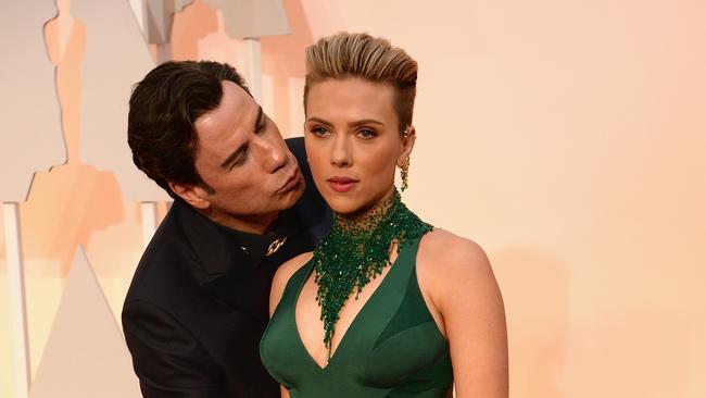 HOLLYWOOD, CA - FEBRUARY 22: Actor John Travolta (L) and actress Scarlett Johansson attend the 87th Annual Academy Awards at Hollywood & Highland Center on February 22, 2015 in Hollywood, California. (Photo by Kevin Mazur/WireImage)