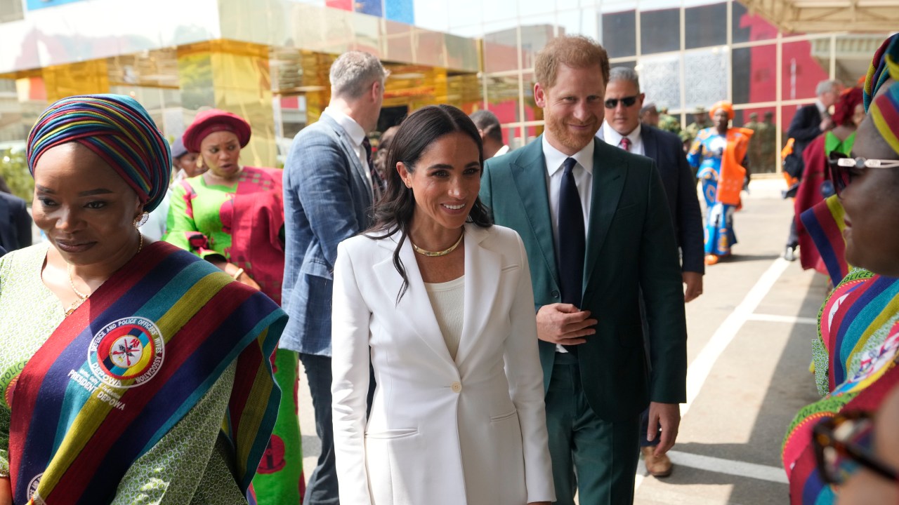 Prince Harry and Meghan visit army wives at the Defence headquarters in Nigeria earlier this month. Picture: AP.