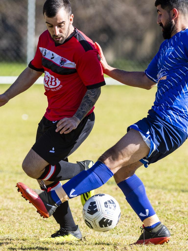 Federico Garcia (left) of Chinchilla Bears and Jalal Alkhudher of Rockville Rovers in Div 1 Men FQ Darling Downs Presidents Cup football at West Wanderers, Sunday, July 24, 2022. Picture: Kevin Farmer