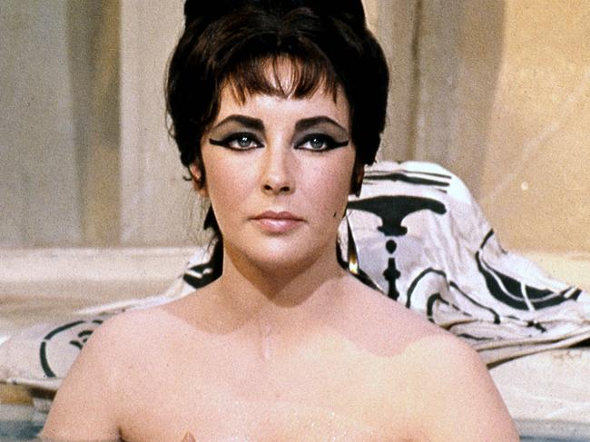 Elizabeth Taylor (1932-2011), British actress, bathing with the water at chest height in a publicity still issued for the film, 'Cleopatra', 1963. The historical drama, directed by Joseph L. Mankiewicz (1909?1993), starred Taylor as 'Cleopatra'. (Photo by Silver Screen Collection/Getty Images)