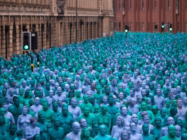 Naked volunteers, painted in blue to reflect the colours found in Marine paintings in Hull’s Ferens Art Gallery, participate in US artist, Spencer Tunick’s “Sea of Hull” installation in Kingston upon Hull on July 9, 2016. Picture: AFP PHOTO / JON SUPER