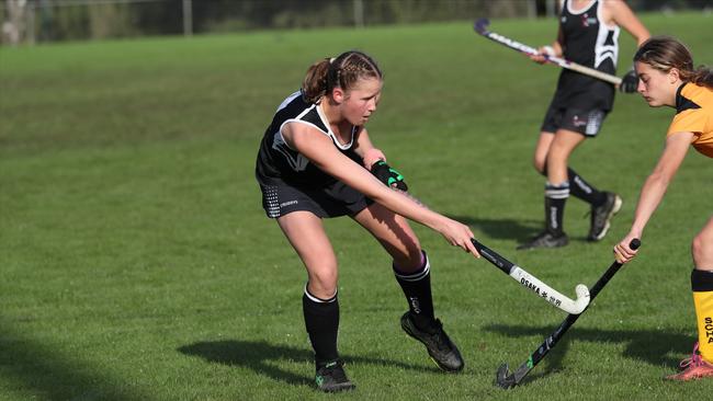 Skye Vaughan, 13, playing hockey for the Norths Hockey Club. Picture: Contributed