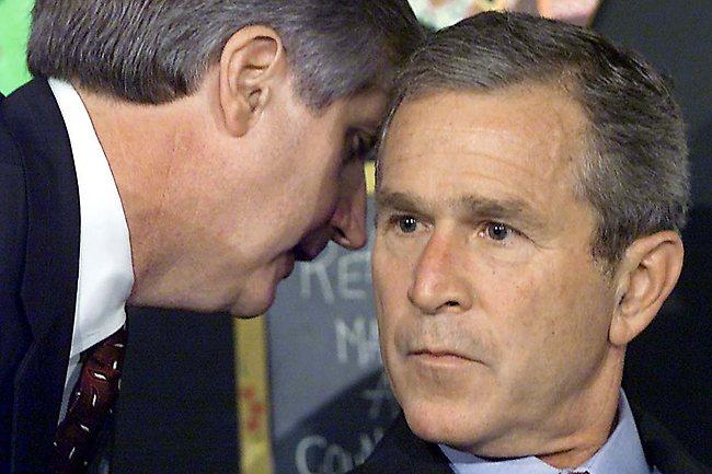 The moment US President George W. Bush learned of the 9/11 twin tower attacks from his then Chief of Staff Andrew Card. He was reading to school children at the time. AFP