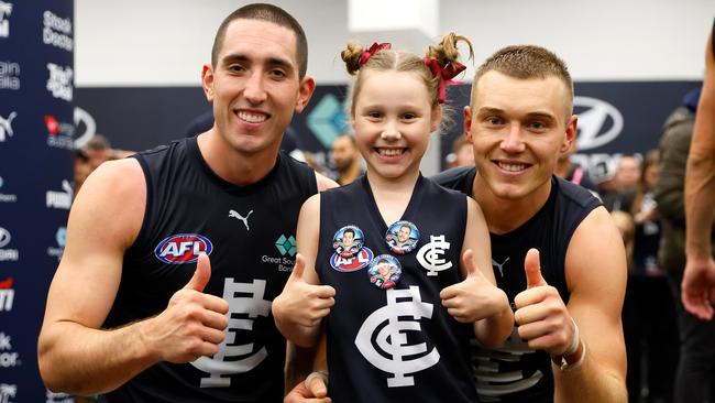 Jacob Weitering and Patrick Cripps with Chiara. Picture: Dylan Burns