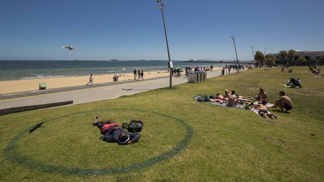 Beachgoers enjoy the sun at Melbourne’s St Kilda beach, Victoria. Picture: NCA NewsWire / Daniel Pockett