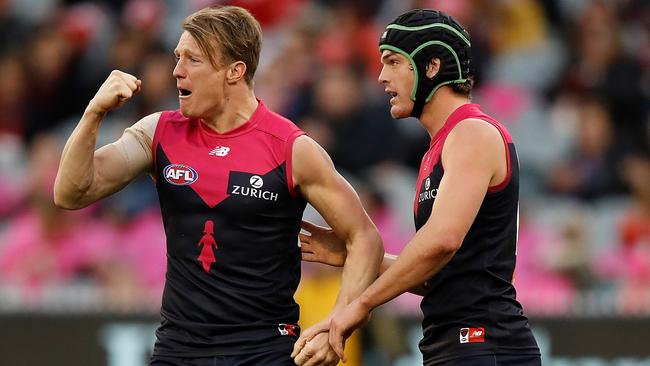 Aaron vandenBerg (left) loves the Demons but family is weighing on his mind. Pic: Getty Images