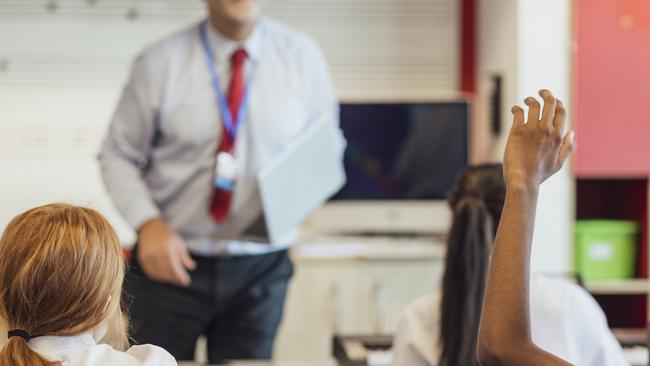 A Qld teacher who repeatedly walked in on girls while changing and admitted to kissing two teenagers has been removed from registry of teachers.