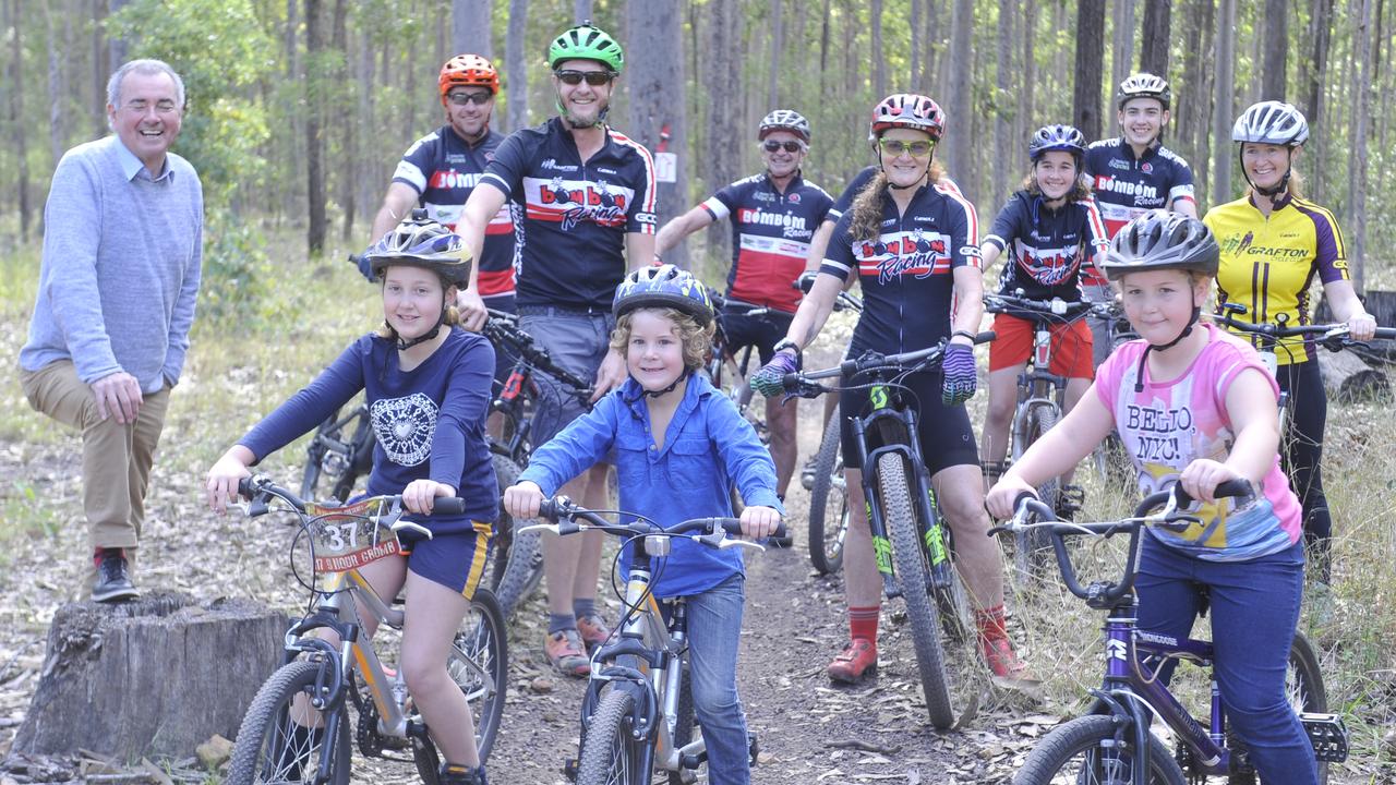 Clarence MP Chris Gulaptis at the Bom Bom Forest Mountain Bike Park to announce a $128,000 upgrade to the trails. Grafton Cycle Club president Grant Hodgins and Michelle Newstead were also on hand. Photo: Mitchell Keenan