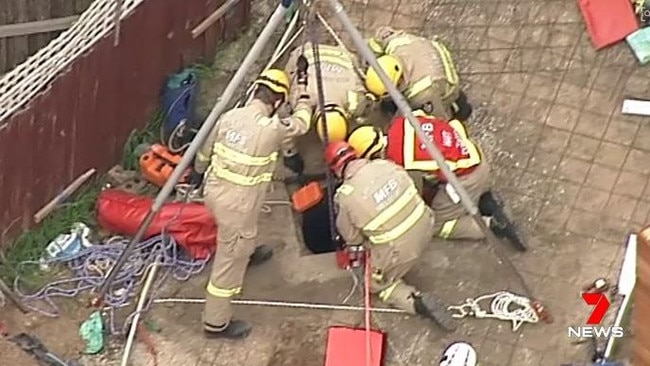 Emergency services workers rescuing the man trapped in Mentone. Picture: Channel 7