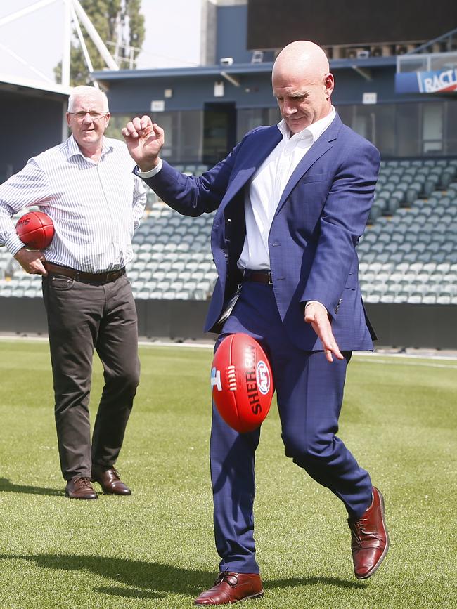 Premier Peter Gutwein kicking a football with Errol Stewart at UTAS Stadium in Launceston. Picture: PATRICK GEE