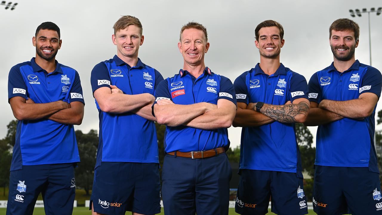 New Kangaroos coach David Noble (centre) poses with players Tarryn Thomas, Jack Ziebell, Jy Simpkin and Luke McDonald. Picture: Quinn Rooney/Getty Images)