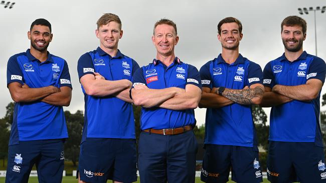 New Kangaroos coach David Noble (centre) poses with players Tarryn Thomas, Jack Ziebell, Jy Simpkin and Luke McDonald. Picture: Quinn Rooney/Getty Images)