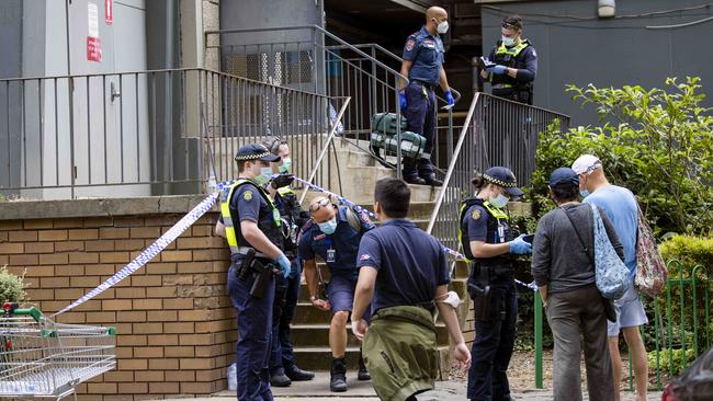 Police investigate the Sutton Street unit where a man was allegedly murdered and another seriously injured on Saturday. Picture: Nicole Cleary