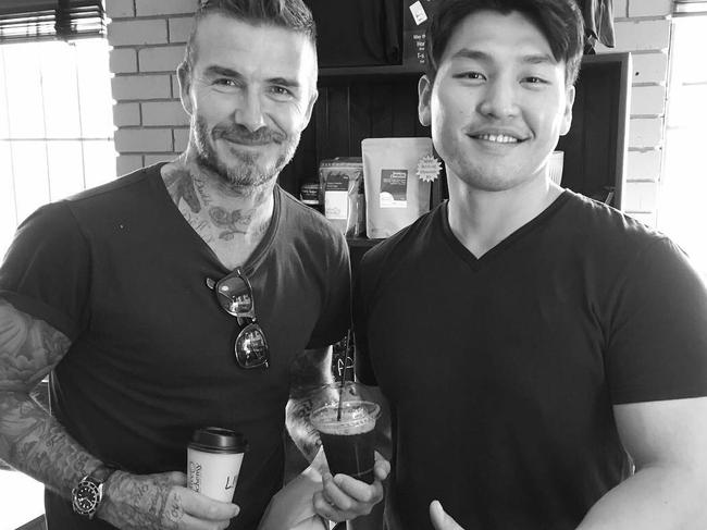 David, with Coffee Alchemy employee Romano, tried Sydney’s coffee. Picture: Supplied