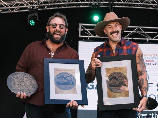 25/01/2024: Tasmanian country rock duo The Wolfe Brothers accepting a bronze plaque to mark their induction into the 'galaxy of stars', as part of the annual Tamworth Country Music Festival. L-R: Tom Wolfe, Nick Wolfe. Picture: Antony Hands