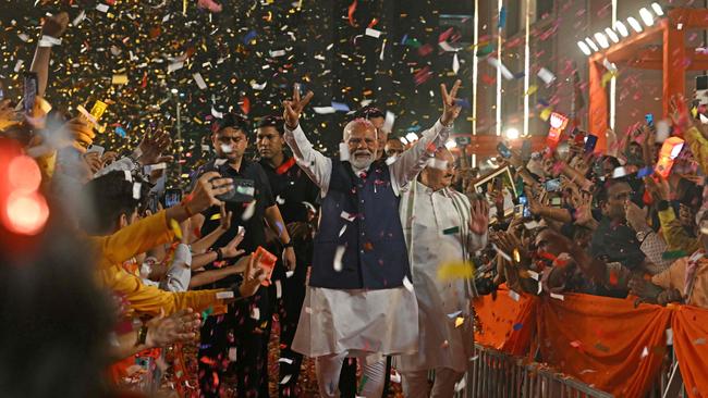 India’s Prime Minister Narendra Modi flashes a victory sign as he arrives at the Bharatiya Janata Party headquarters to celebrate the party’s general election win. Picture: AFP